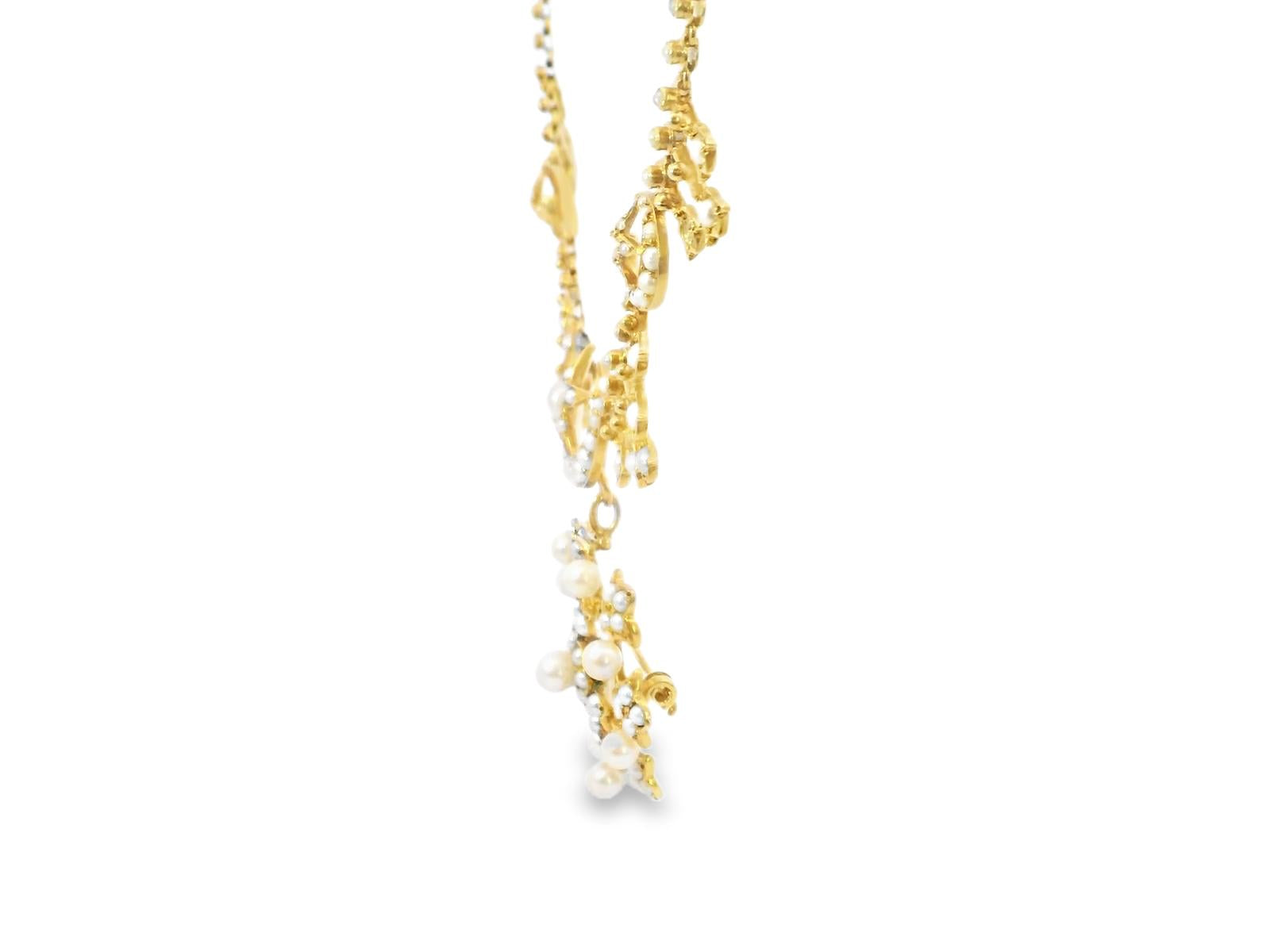 A Victorian 14kt gold and pearl fringe necklace, designed with crescent and star